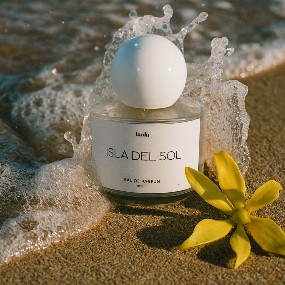 Perfume bottle labeled 'Isla del Sol' on a beach with waves and a yellow flower. the perfume sells like soleil blanc by tom ford